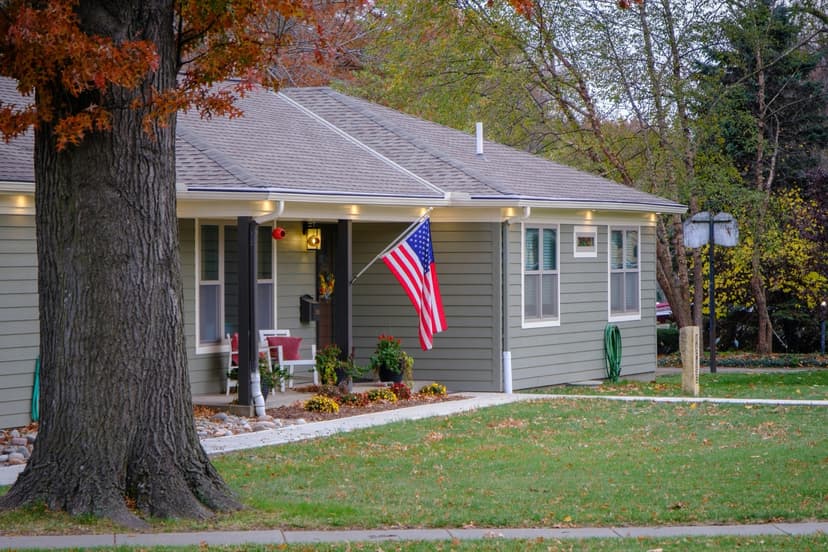 Beautiful American home with American flag - VA IRRRL refinance helps veterans secure their dream home with streamlined refinancing process